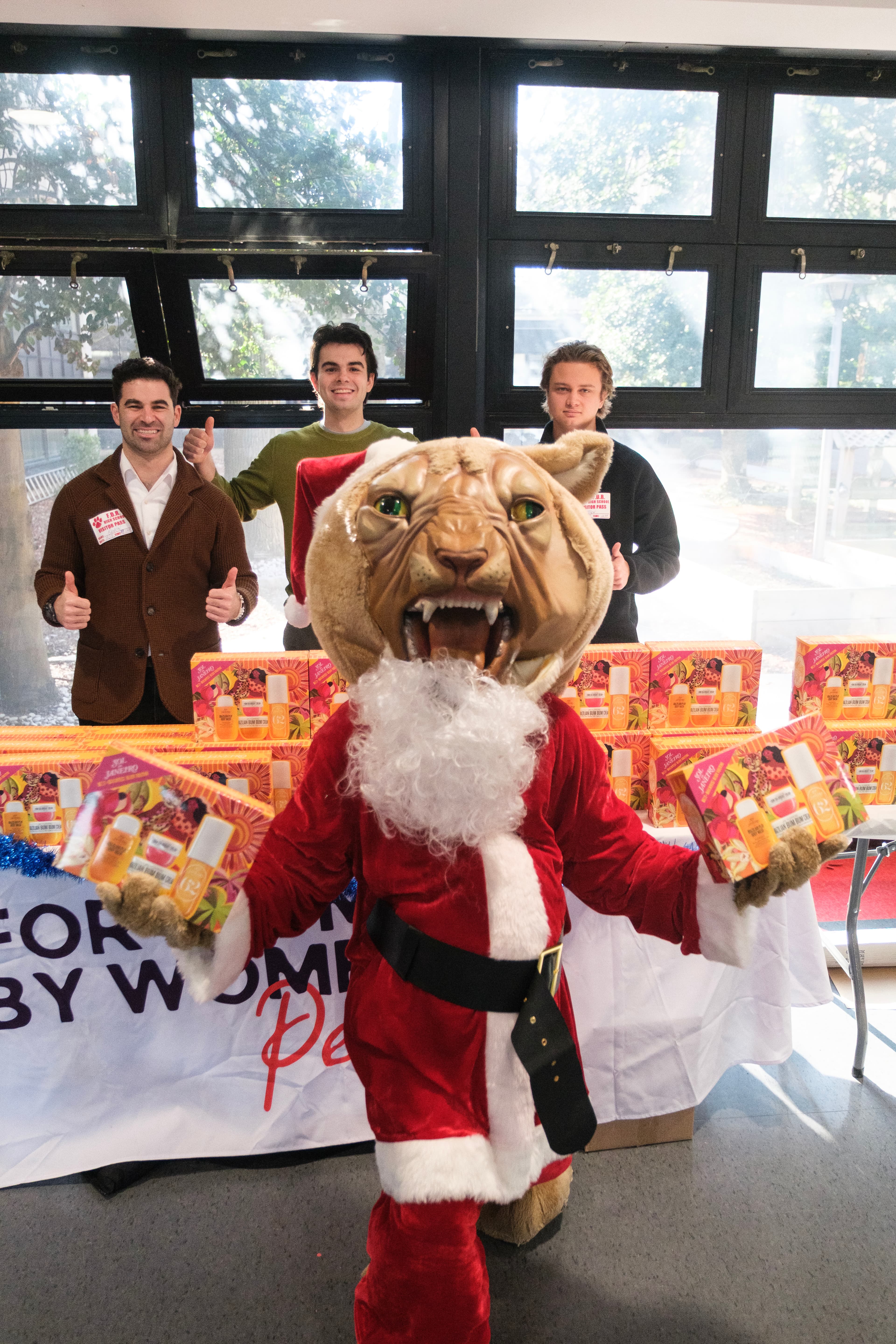 Volunteers and recipients at a holiday gift drive