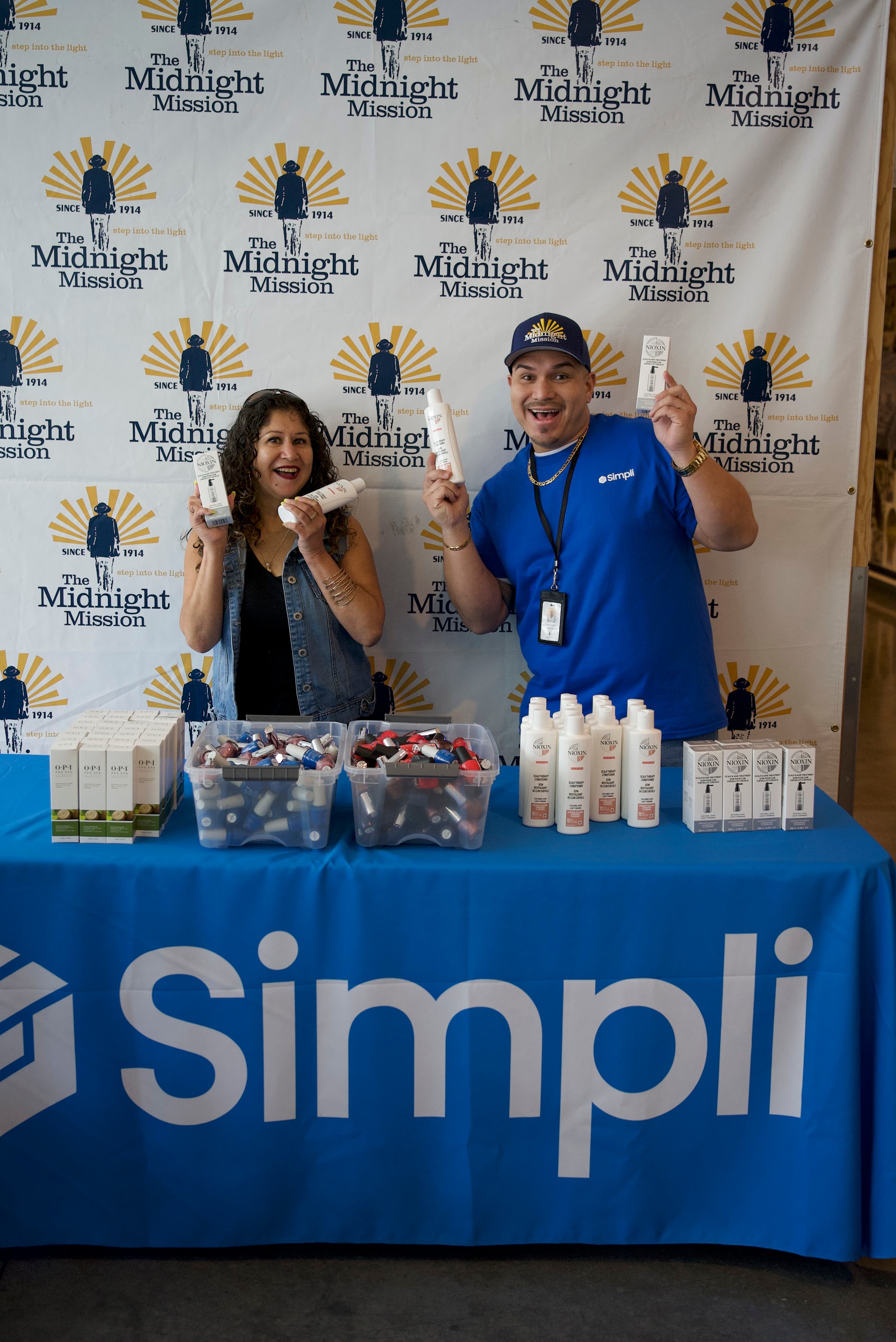 Simpli team at a donation table with The Midnight Mission
